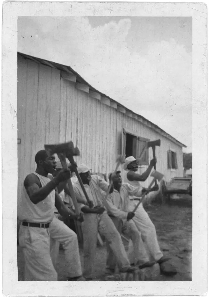 "Lightnin" Washington, an African American prisoner, singing with his group in the woodyard at Darrington State Farm, Texas