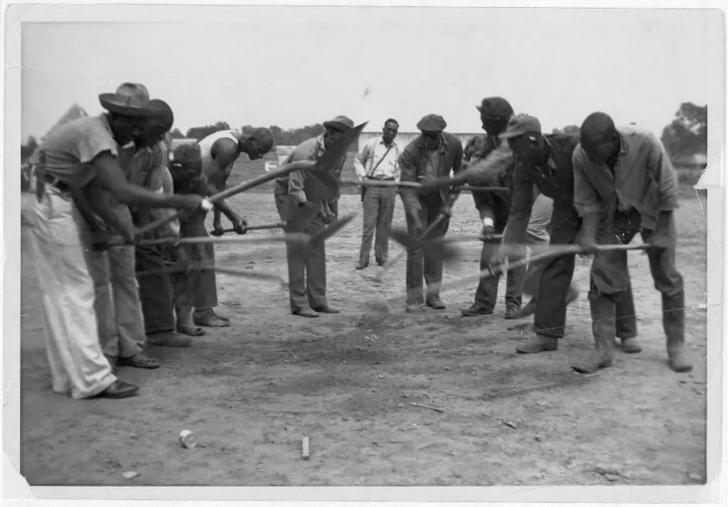 African American convicts working with shovels, possibly the singers of "Rock Island Line" at Cummins State Farm, Gould, Arkansas, 1934